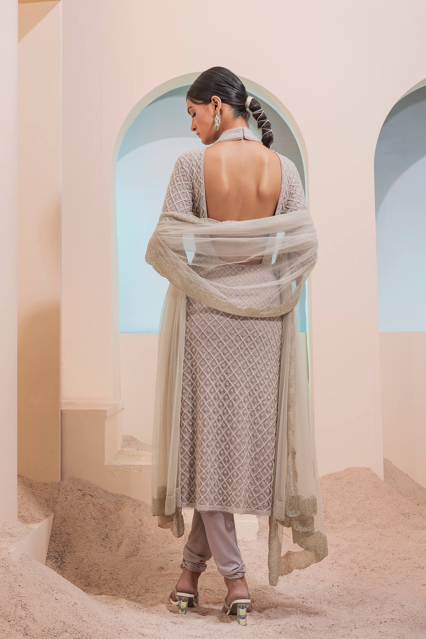Stone Grid Work Tunic With Cutout Back Paired With A Lycra Churidar And Scalloped Tulle Dupatta