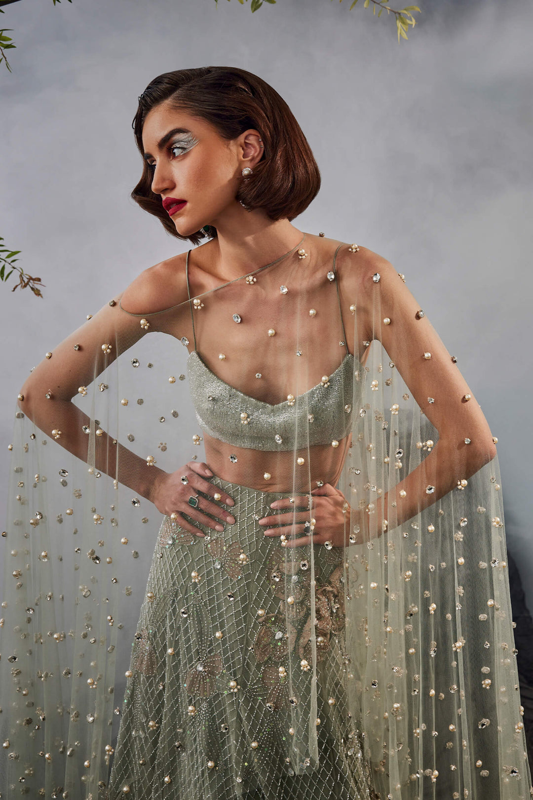 Grid Work Lehenga With Beaded Blouse And Stone Embellished Cape
