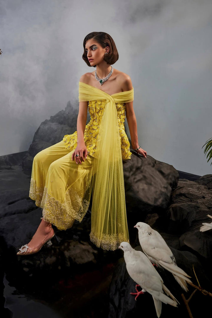 Feather Embellished Peplum Top With Wide Legged Trousers And Shoulder Drape