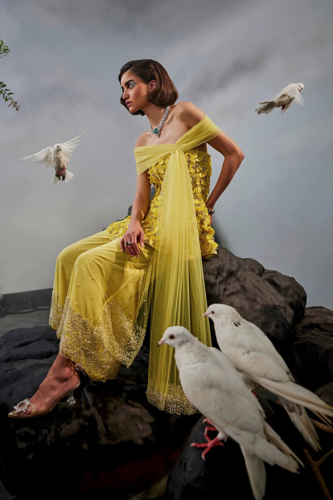 Feather Embellished Peplum Top With Wide Legged Trousers And Shoulder Drape